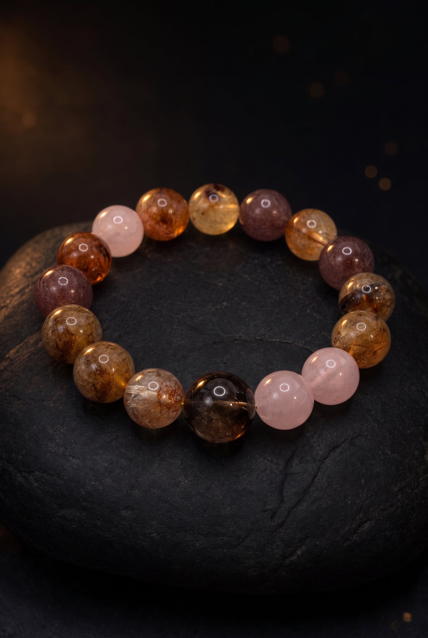 Ember Rose — macro on black stone