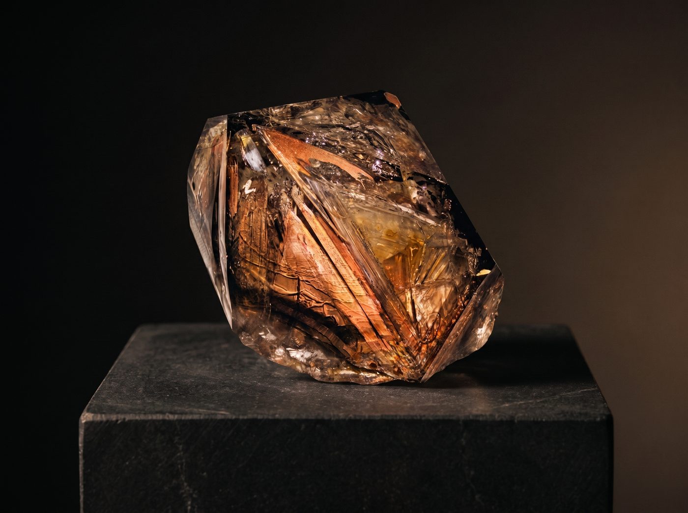 Azeztulite rough specimen on dark stone