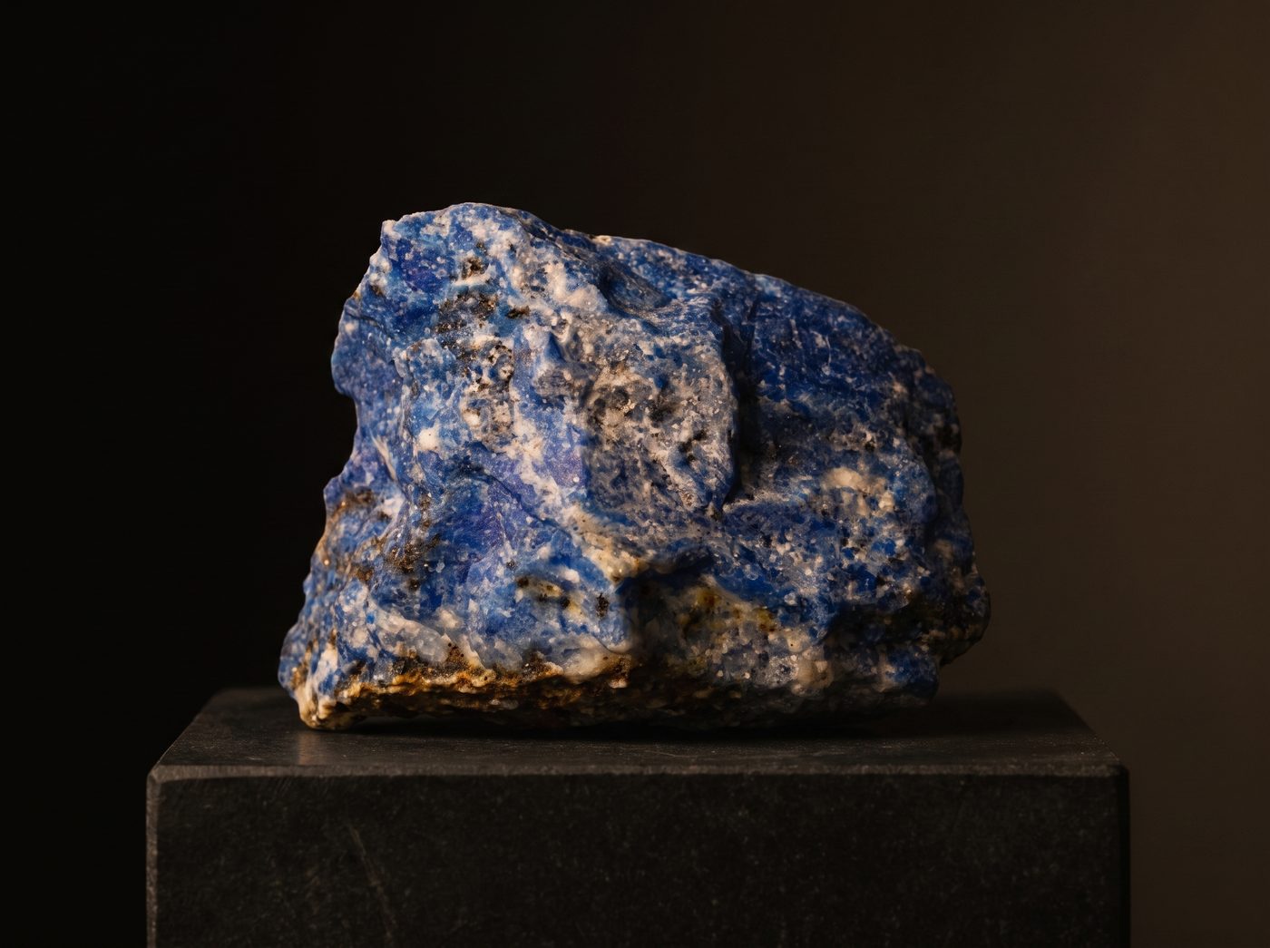 Lapis Lazuli rough specimen on dark stone
