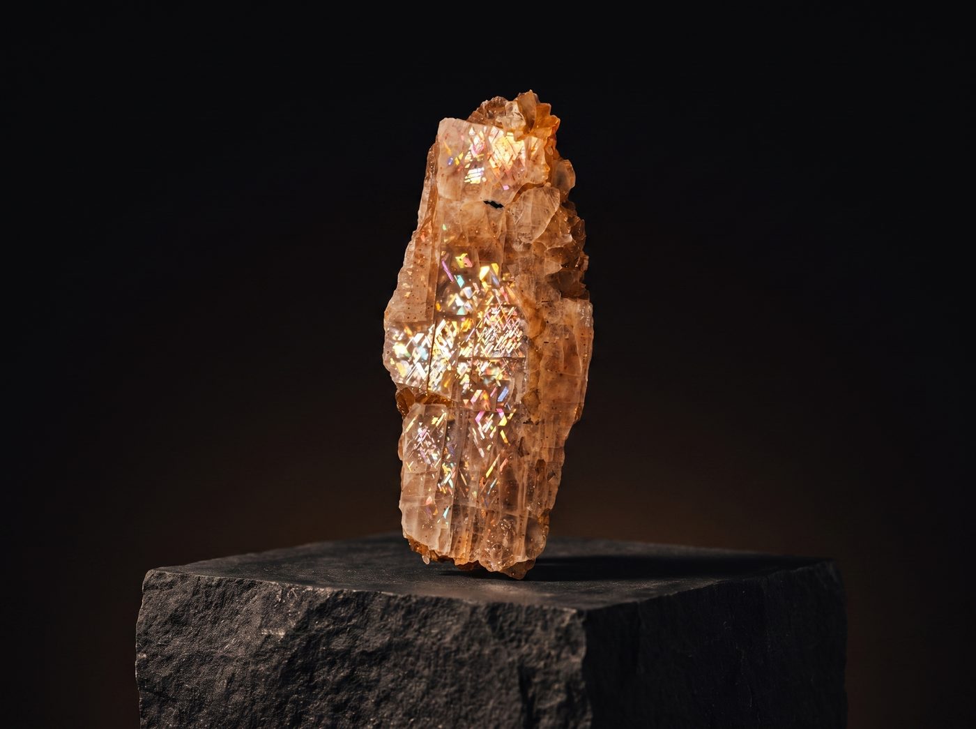 Sunstone rough specimen on dark stone