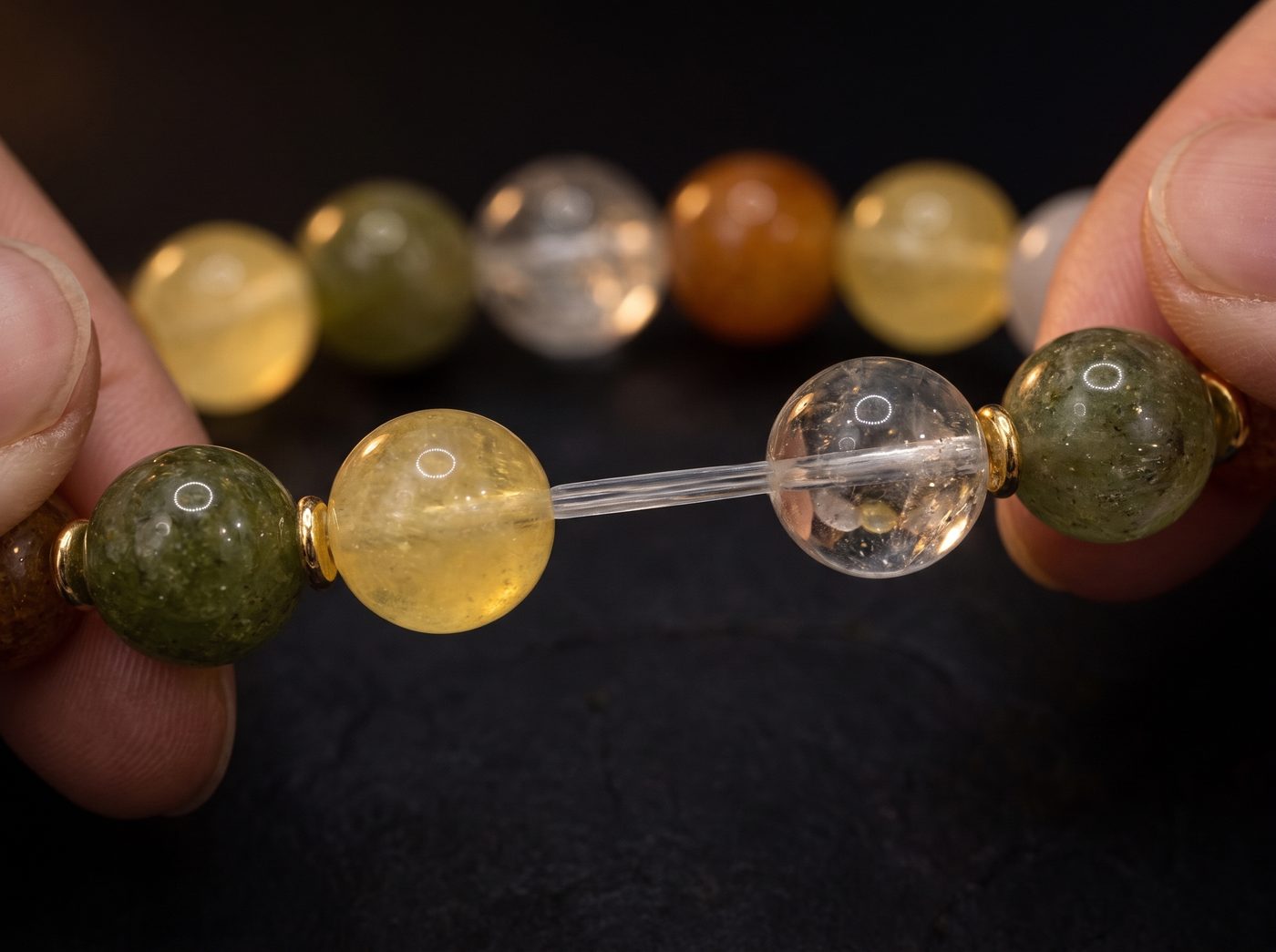 Bracelet gently stretched to show the elastic cord between the beads